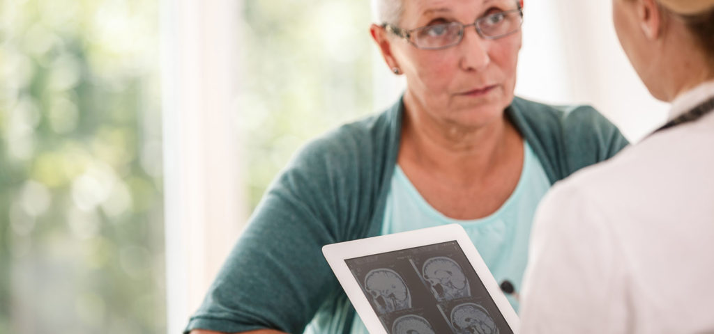 A woman gets a brain tumor second opinion to consider her treatment options.