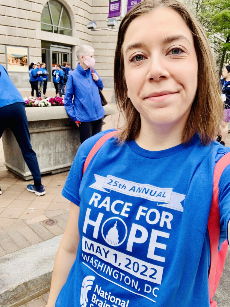 A young adult woman wears a 2022 Race for Hope DC t-shirt. 