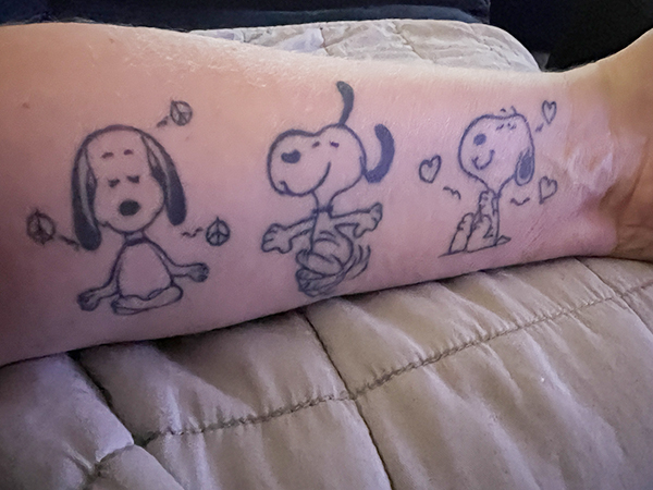 Cathy selected three Snoopy tattoos.