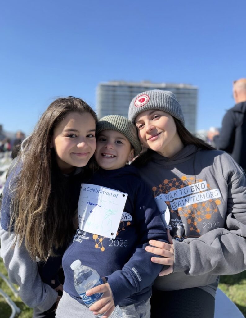A mom and her two kids smile for a photo at the National Brain Tumor Society's New Jersey Brain Tumor Walk.