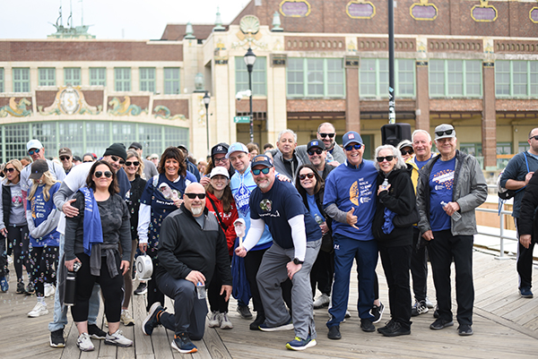 A group of more than 15 people pose together for a group photo at the New Jersey Brain Tumor Walk.